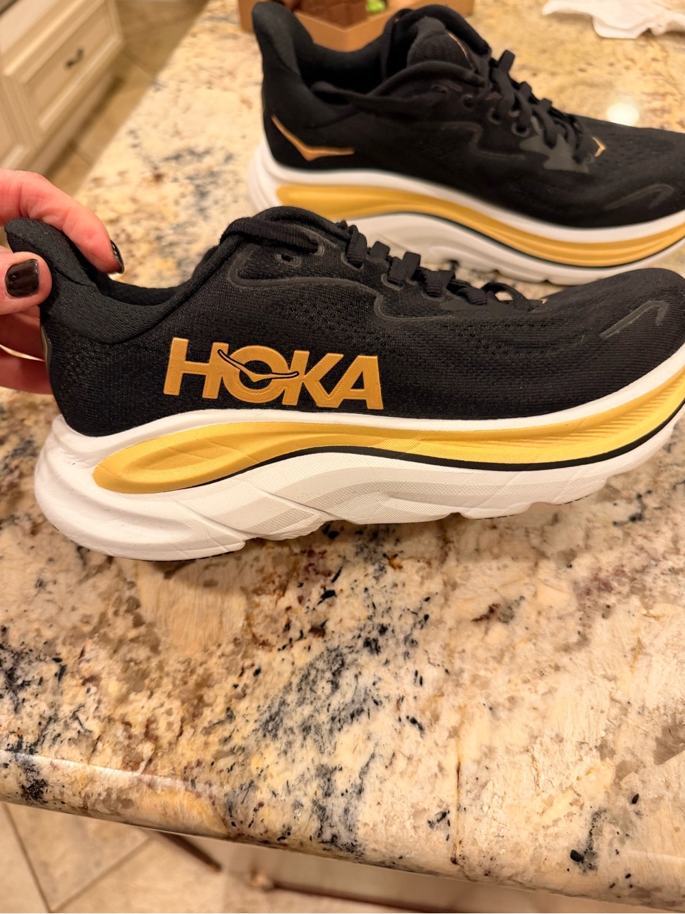 Hoka Clifton 10 women’s Black and Gold Women's Athletic Running Shoes